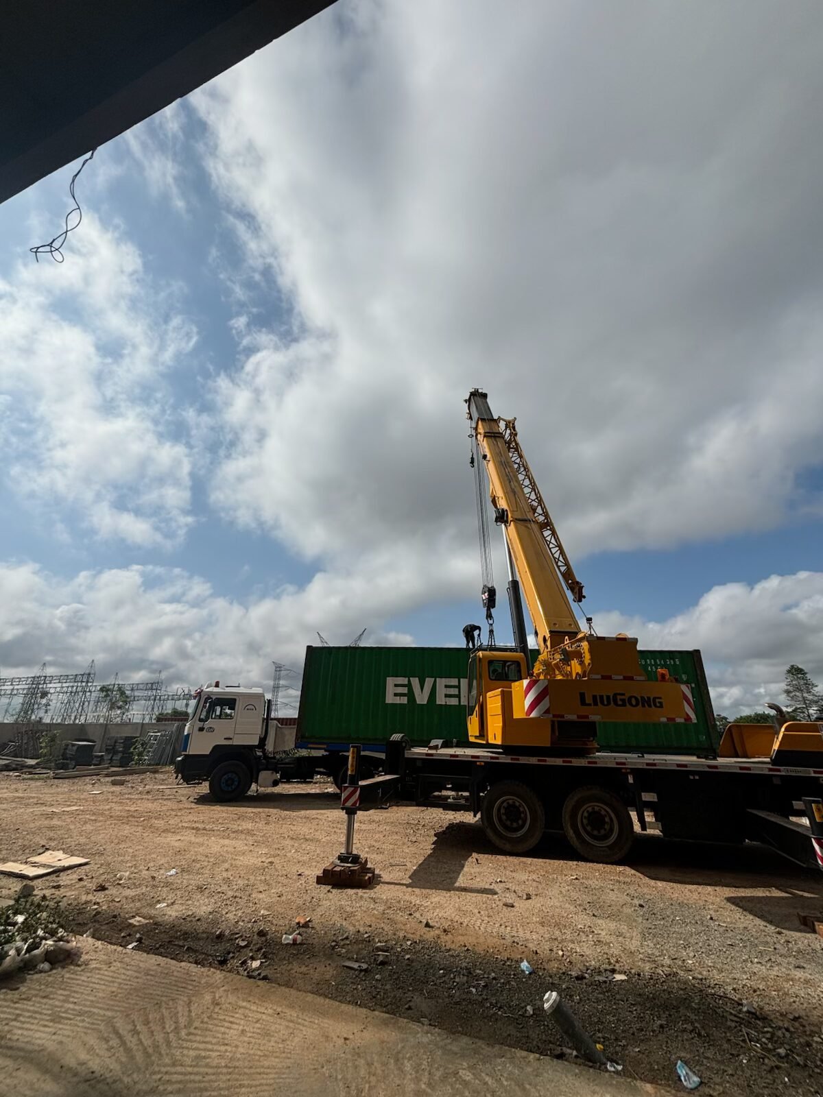 Crane offloading materials on a Brainsfield site